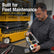 Technician inspecting a SAIYIS 156879 control box in a workshop with a Skyjack SJIII scissor lift in the background